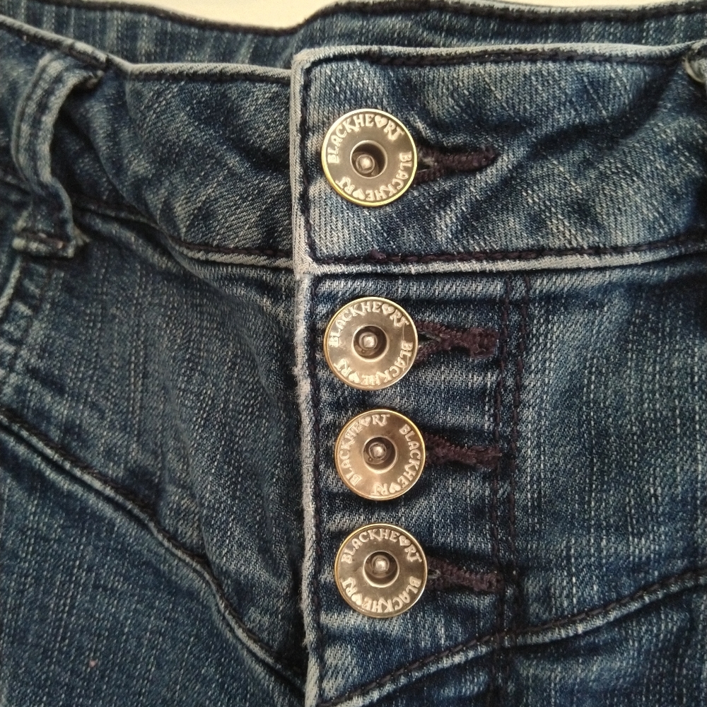 High-waisted, metal-skull accent jean shorts